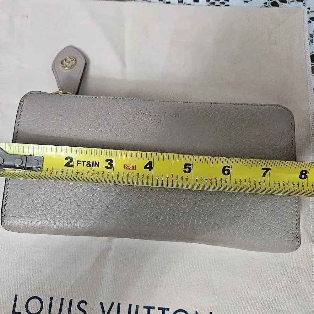Louis Vuitton Taurillon portefeuille Comete long zip wallet